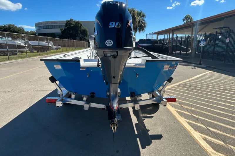 Slide: The Image of 2026 Avid 18 Rogue CC boat with Yamaha 90 engine on trailer, sunny day. - 5