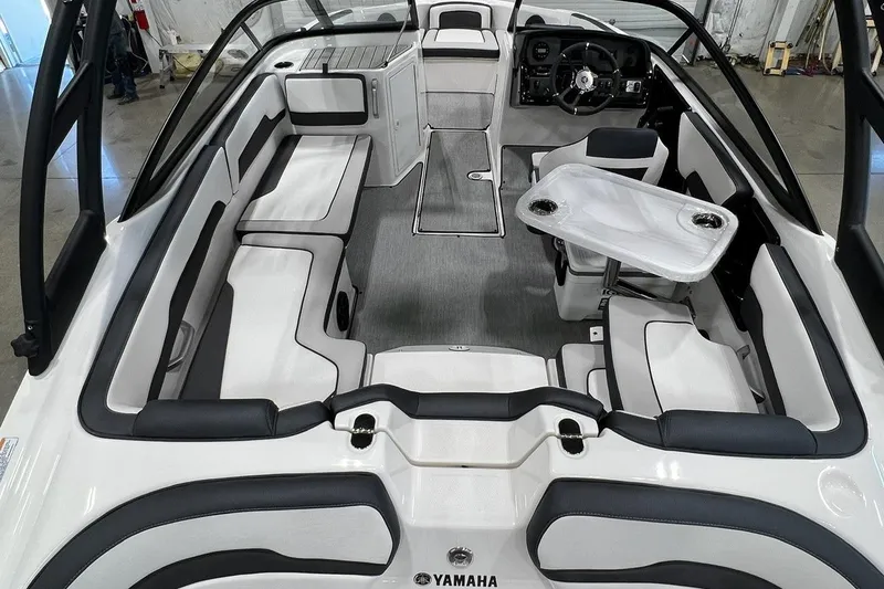 Slide: The Image of 2025 Yamaha Boats AR195 interior with sleek seating and modern steering console. - 3