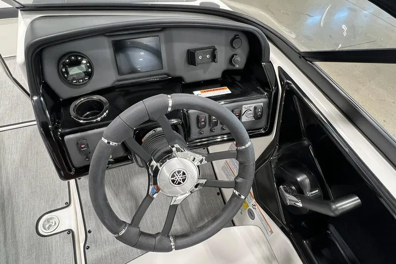 Slide: The Image of 2025 Yamaha Boats AR195 dashboard with steering wheel and control panel. - 6