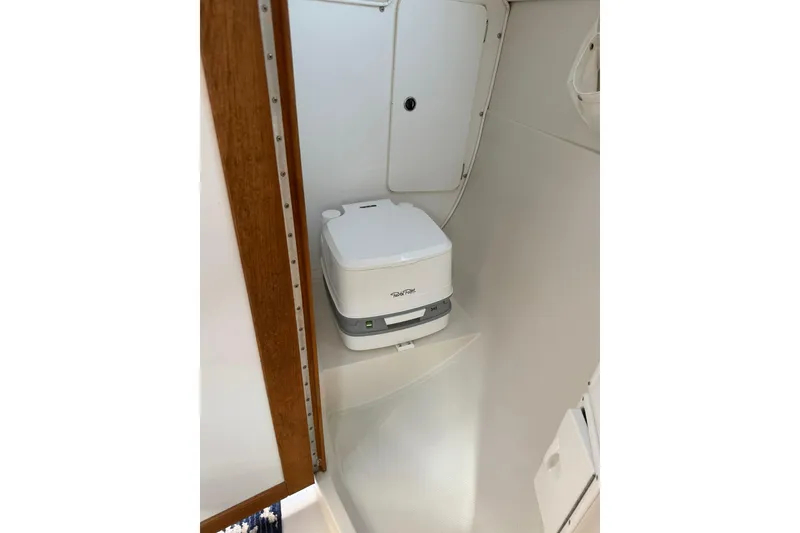 Slide: The Image of Compact marine toilet in 2000 Catalina 250 MkII sailboat bathroom. - 12