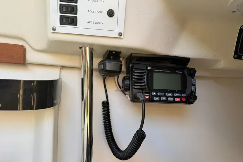 Slide: The Image of VHF radio and control panel inside a 2000 Catalina 250 MkII sailboat. - 15