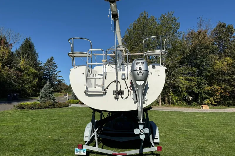 Slide: The Image of Catalina 250 MkII sailboat, 2000 model, on trailer in grassy area with trees. - 4