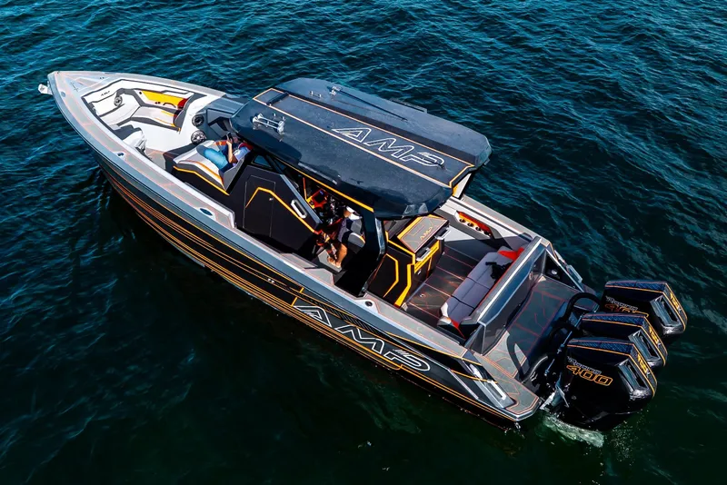 Slide: The Image of 2026 AMP 333 boat on water, featuring sleek design and powerful engines. - 12