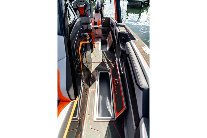 Slide: The Image of Interior of 2026 AMP 333 boat with sleek seating and storage compartments. - 21