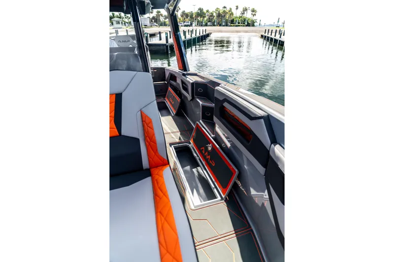 Slide: The Image of Interior of 2026 AMP 333 boat with modern seating and storage compartments. - 22