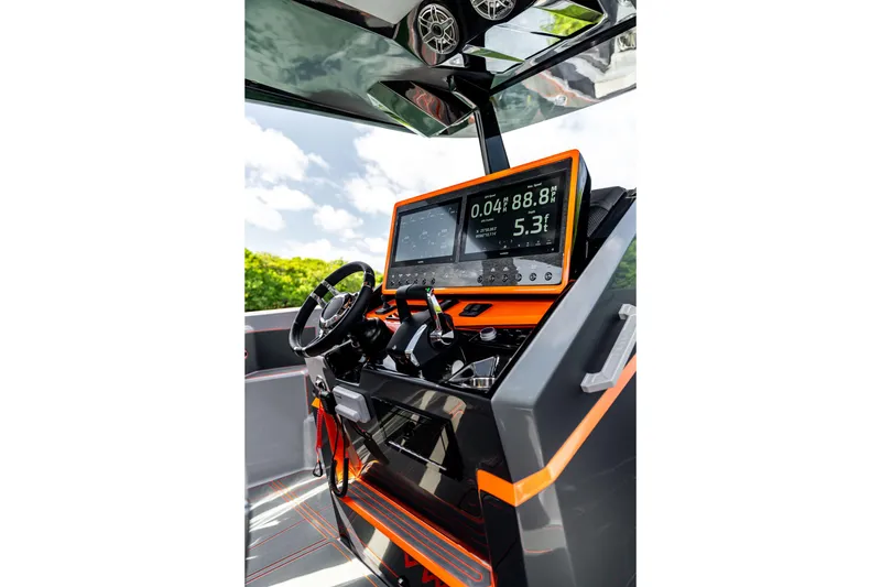 Slide: The Image of Futuristic AMP 333 boat dashboard with digital display, steering wheel, and controls, 2026 model. - 28