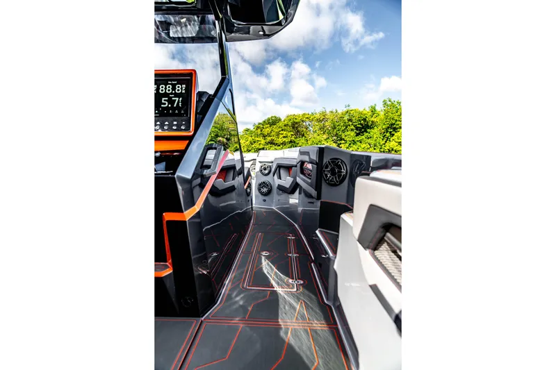 Slide: The Image of Futuristic AMP 333 boat interior with advanced dashboard, sleek design, and vibrant accents, 2026 model. - 29
