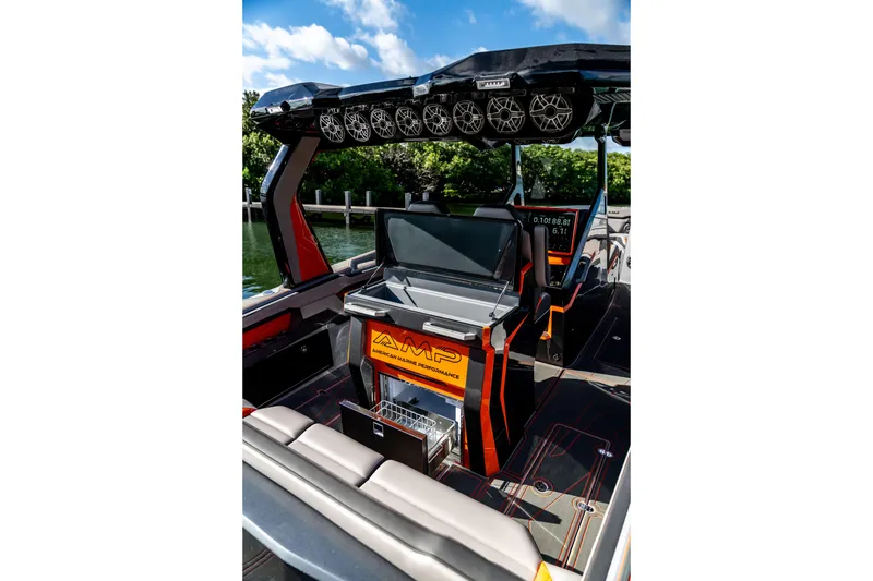 Slide: The Image of 2026 AMP 333 boat interior with advanced audio system and sleek design. - 35