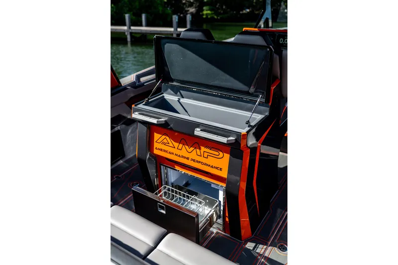 Slide: The Image of 2026 AMP 333 boat interior with open storage compartment and sleek design. - 36