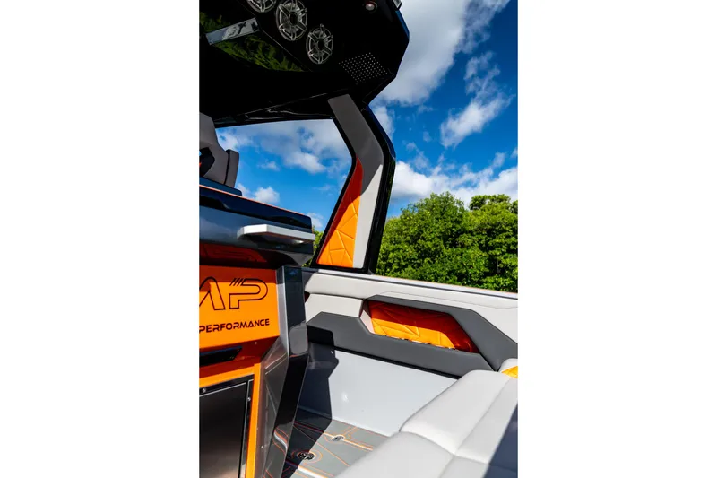 Slide: The Image of Interior of 2026 AMP 333 boat with modern design and vibrant orange accents. - 38