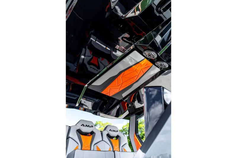Slide: The Image of Interior of 2026 AMP 333 with modern orange and gray seating design. - 48