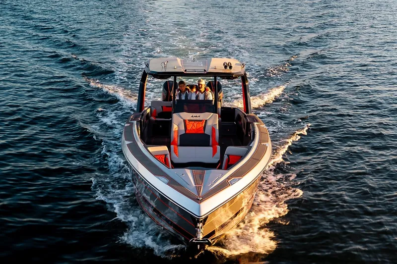 Slide: The Image of 2026 AMP 333 boat cruising on open water with passengers onboard. - 5