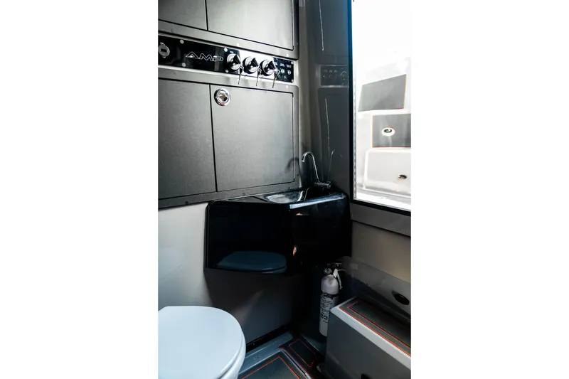 Slide: The Image of Modern AMP 333 vehicle interior bathroom with sleek design, compact sink, and fire extinguisher, 2026 model. - 52