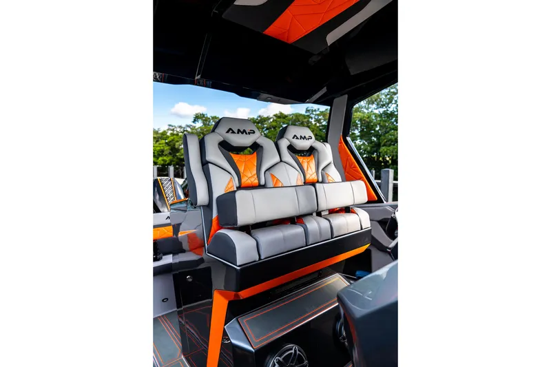 Slide: The Image of Luxurious interior of 2026 AMP 333 with stylish orange and gray seating. - 56