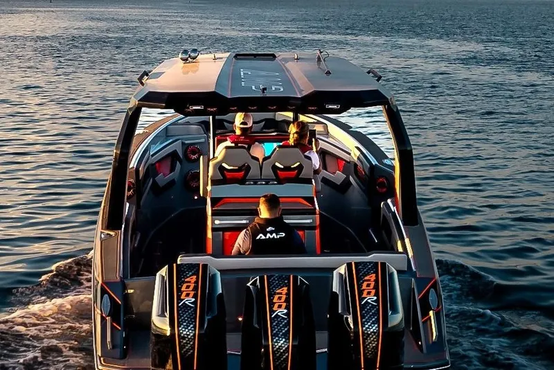 Slide: The Image of Futuristic AMP 333 boat cruising on water, 2026 model, with passengers enjoying the ride. - 6