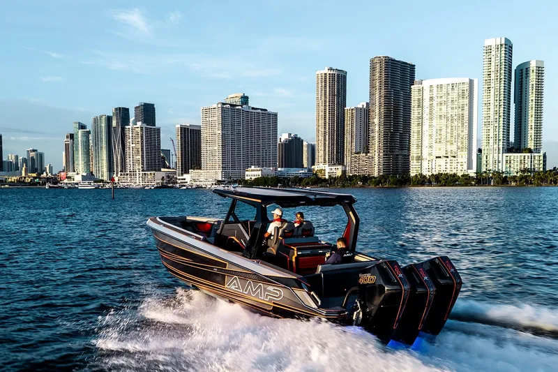 Slide: The Image of High-speed AMP 333 boat cruising near city skyline, 2026 model. - 7