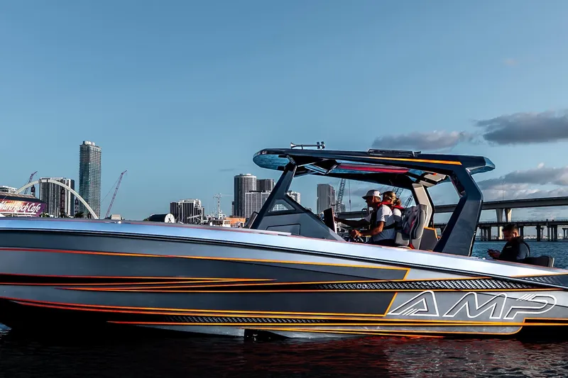 Slide: The Image of Futuristic AMP 333 speedboat cruising near city skyline, 2026 model. - 8
