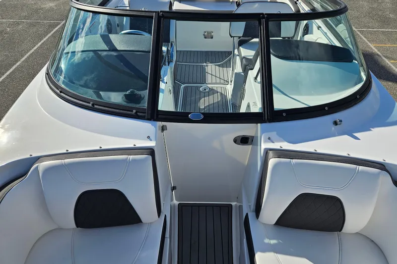 Slide: The Image of 2022 Monterey M-45 boat interior with white seating and sleek windshield design. - 10