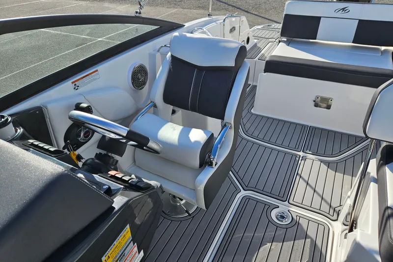 Slide: The Image of Interior of a 2022 Monterey M-45 boat featuring sleek seating and modern controls. - 12