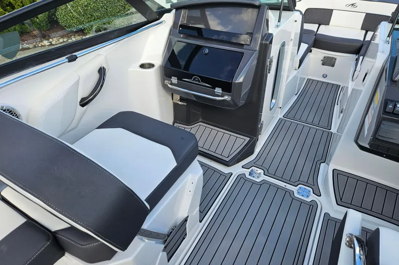 Slide: The Image of 2022 Monterey M-45 boat interior with sleek seating and modern dashboard design. - 13