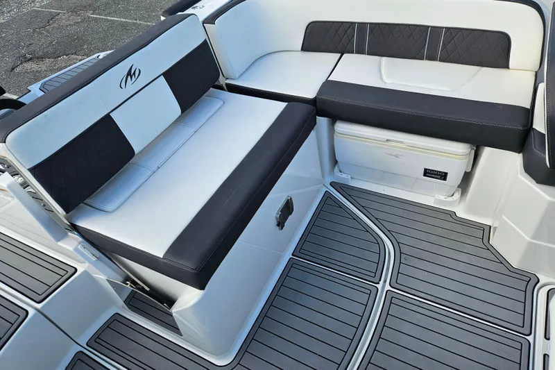 Slide: The Image of 2022 Monterey M-45 boat interior with cushioned seating and non-slip flooring. - 19
