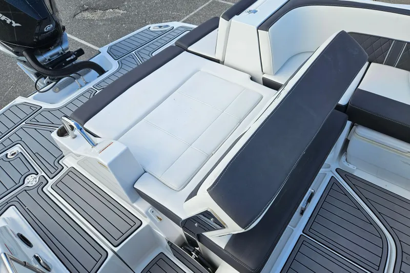 Slide: The Image of 2022 Monterey M-45 boat interior with cushioned seating and sleek design. - 21