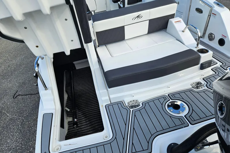 Slide: The Image of 2022 Monterey M-45 boat interior with seating and storage compartment. - 26
