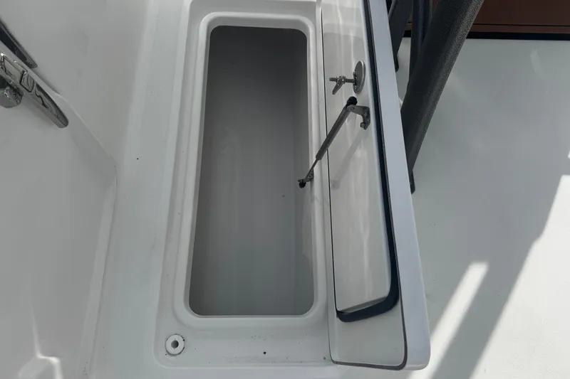 Slide: The Image of Open storage compartment on 2026 Sea Pro 262 Offshore boat. - 10