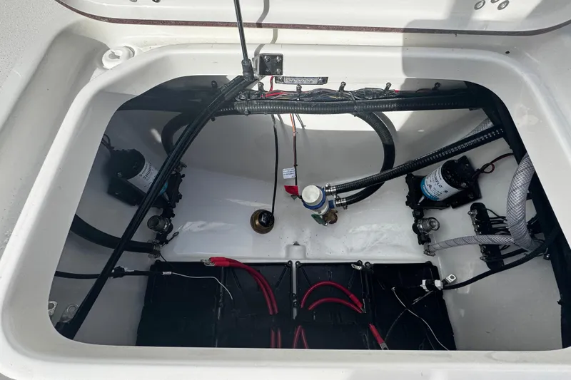 Slide: The Image of 2026 Sea Pro 262 Offshore boat compartment with wiring and components. - 12