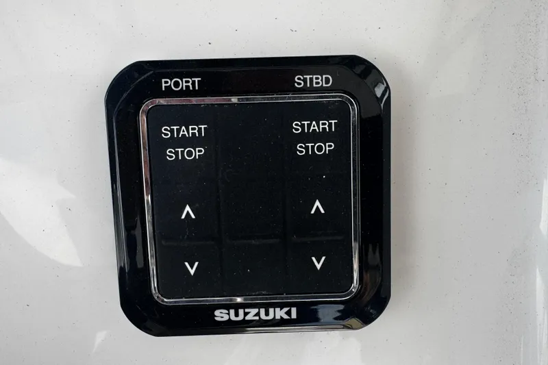 Slide: The Image of Control panel of a 2026 Sea Pro 262 Offshore boat with Suzuki engine controls. - 19