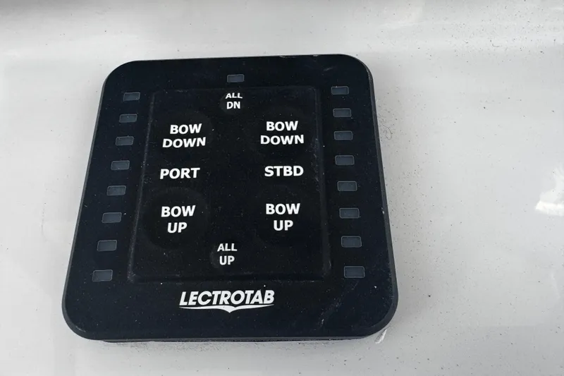 Slide: The Image of Control panel for Lectrotab trim tabs on a 2026 Sea Pro 262 Offshore boat. - 21