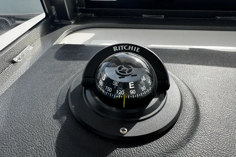 Slide: The Image of Compass on 2026 Sea Pro 262 Offshore boat dashboard, displaying cardinal directions. - 25