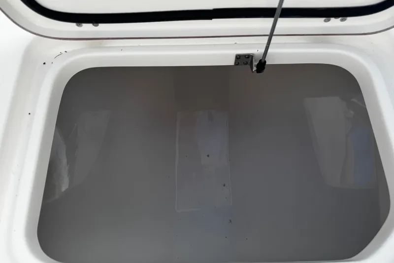 Slide: The Image of Open storage compartment on 2026 Sea Pro 262 Offshore boat. - 38