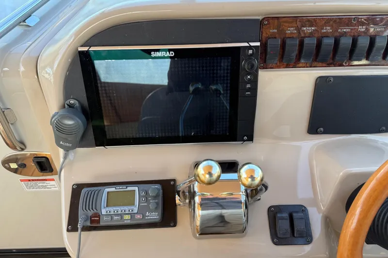 Slide: The Image of Control panel of a 2005 Sea Ray 290 Amberjack boat with Simrad display. - 14
