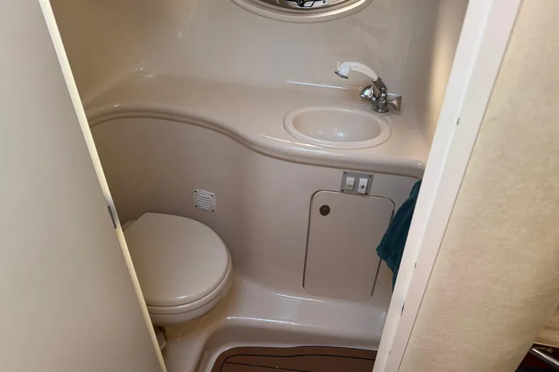 Slide: The Image of 2005 Sea Ray 290 Amberjack boat bathroom with sink and toilet. - 20