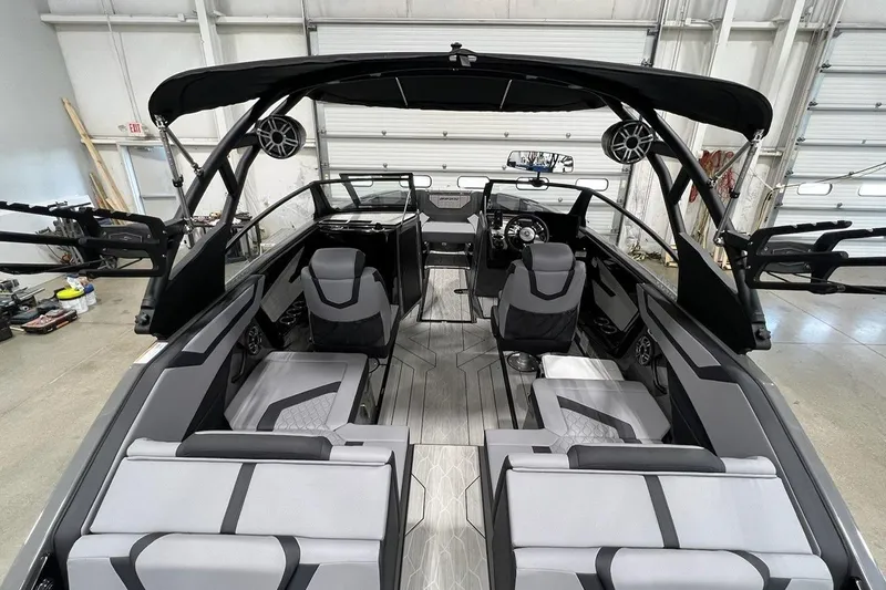 Slide: The Image of 2025 Yamaha Boats 222XD interior, showcasing sleek seating and modern design in a spacious layout. - 4