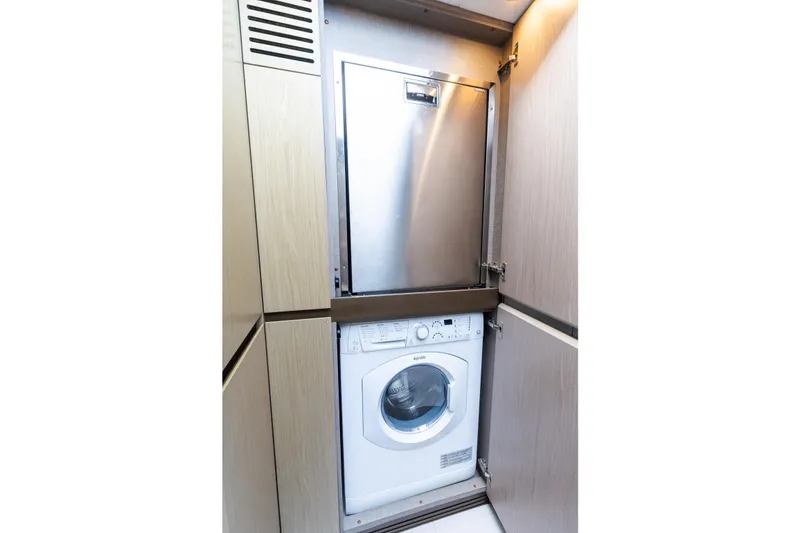 Slide: The Image of 2023 Azimut Fly 50 yacht interior with built-in washer and dryer. - 110