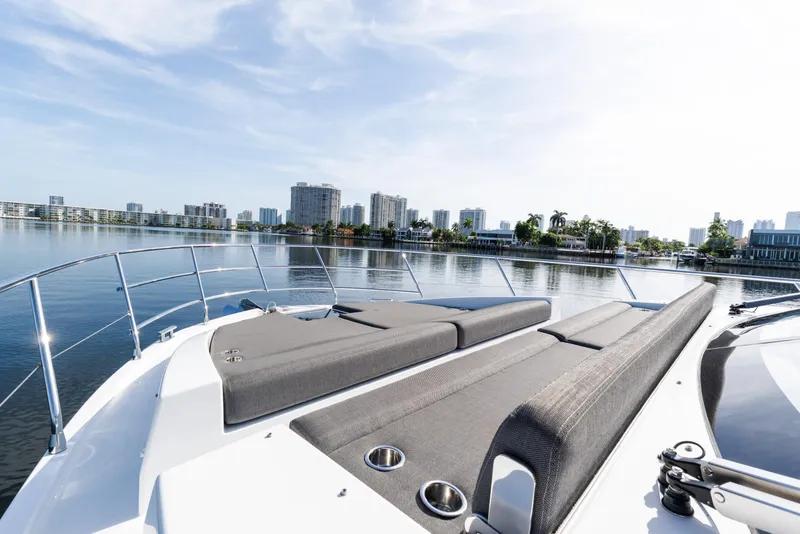 Slide: The Image of Luxurious 2023 Azimut Fly 50 yacht with spacious deck, city skyline in background. - 30