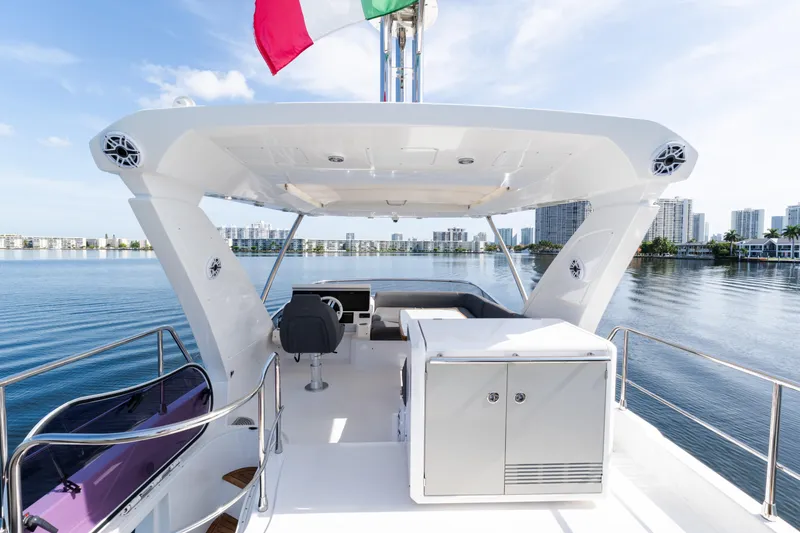Slide: The Image of 2023 Azimut Fly 50 yacht deck with city skyline and water view. - 34