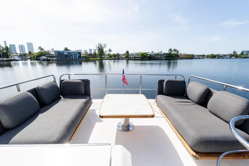 Slide: The Image of Luxurious 2023 Azimut Fly 50 yacht deck with elegant seating and scenic waterfront view. - 39