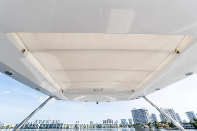 Slide: The Image of 2023 Azimut Fly 50 yacht canopy with city skyline in the background. - 55