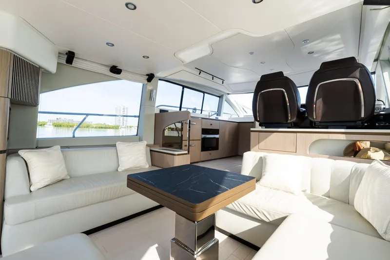 Slide: The Image of Luxurious interior of 2023 Azimut Fly 50 yacht with modern seating and panoramic windows. - 59