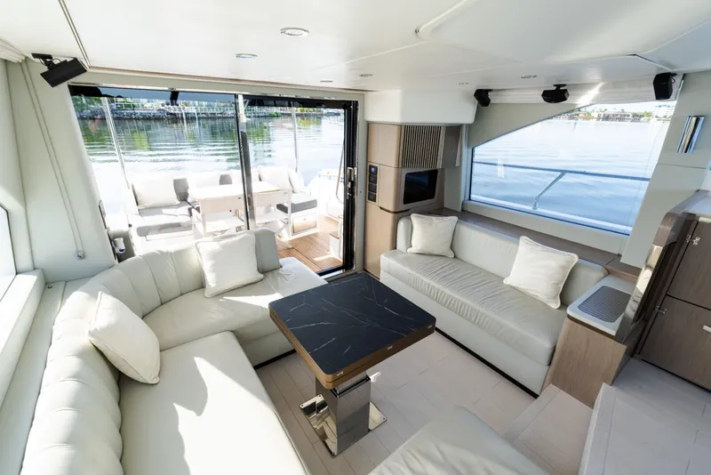 Slide: The Image of Luxurious interior of 2023 Azimut Fly 50 yacht with elegant seating and scenic water view. - 70