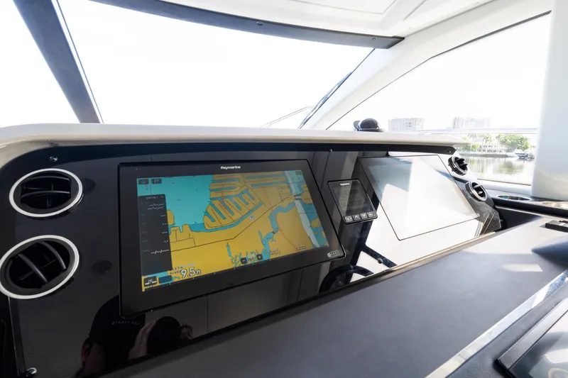 Slide: The Image of 2023 Azimut Fly 50 yacht dashboard with navigation display and controls. - 79