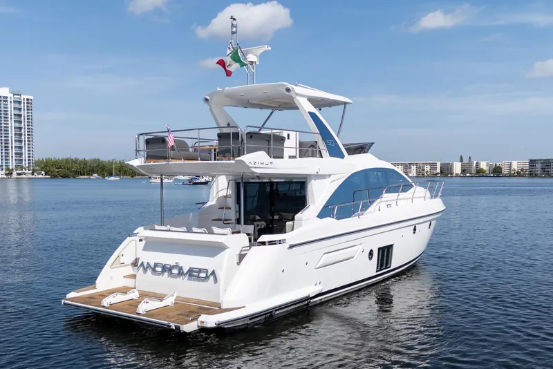Slide: The Image of 2023 Azimut Fly 50 yacht on calm water, showcasing sleek design and luxury features. - 9