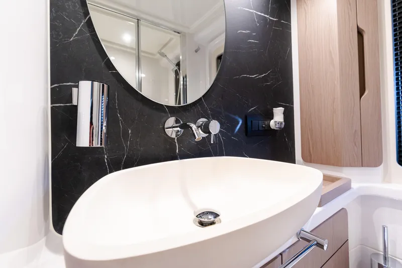 Slide: The Image of Luxurious bathroom in 2023 Azimut Fly 50 yacht with modern sink and mirror. - 95