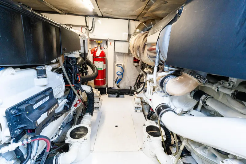Slide: The Image of Engine room of 2023 Azimut Fly 50 yacht, featuring modern equipment and fire extinguisher. - 114