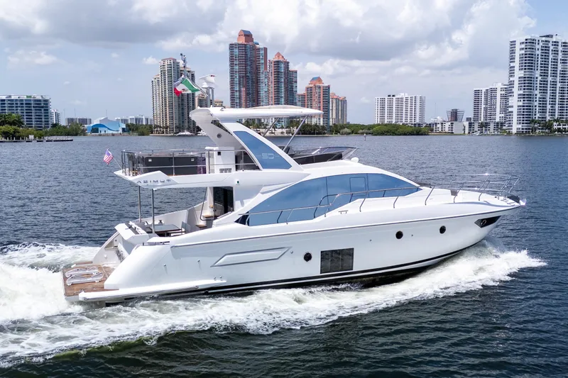 Slide: The Image of 2023 Azimut Fly 50 yacht cruising near city skyline on a sunny day. - 118