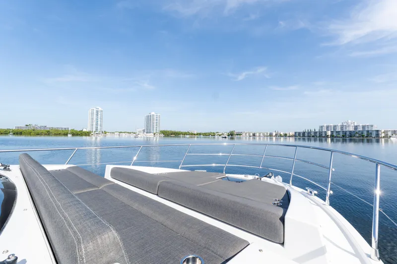 Slide: The Image of Luxurious 2023 Azimut Fly 50 yacht deck with scenic waterfront view. - 26