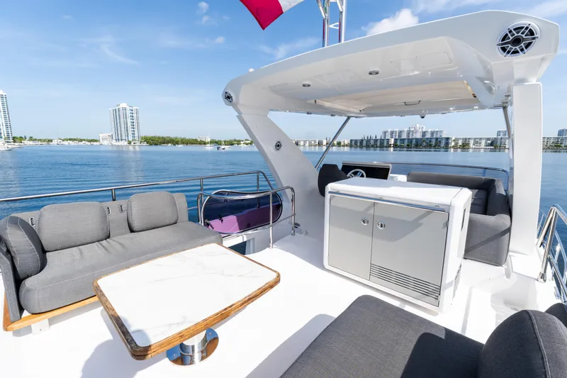 Slide: The Image of Luxurious 2023 Azimut Fly 50 yacht deck with modern seating and scenic waterfront view. - 35